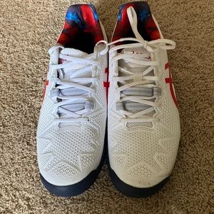 White and red ASICS tennis shoes